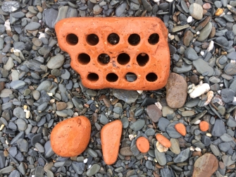 Worn bricks on the beach