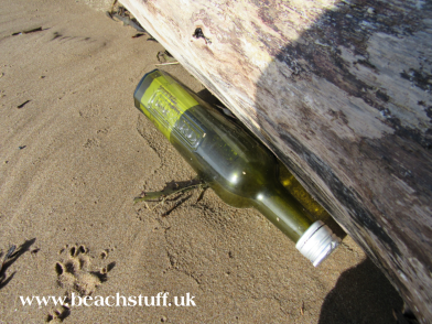 Message in a glass bottle on a beach
